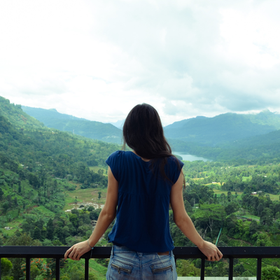 Woman Looking At Mountain View