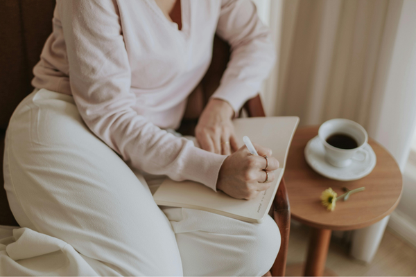 Journaling Woman Writing in Open Book Journaling Woman Writing in Open Book