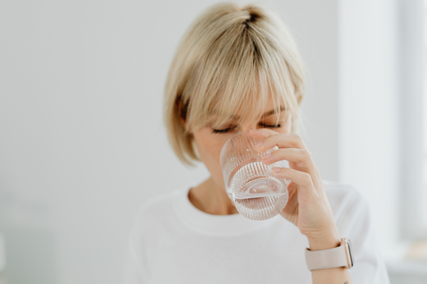 Midlife Woman Drinking Glass Of Water